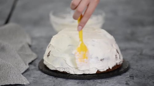 Close Up of Woman Preparing Cake with Vanilla Cream at Home. Making Pancho Cake with Sour Cream