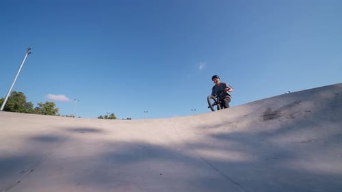 Young Adult Doing BMX Trick in Skatepark
