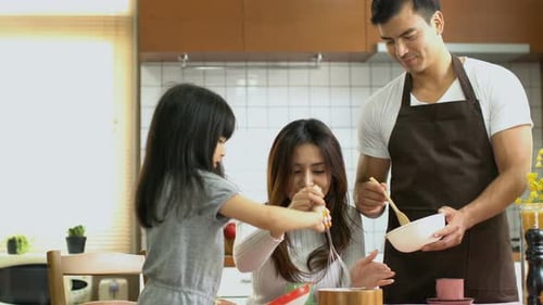 family activities dad mom teach daughter to cook bakery weekend hobby family love concept