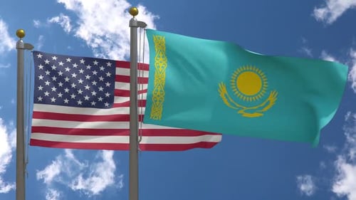 United States and Kazakhstan Flags Waving on Flagpoles