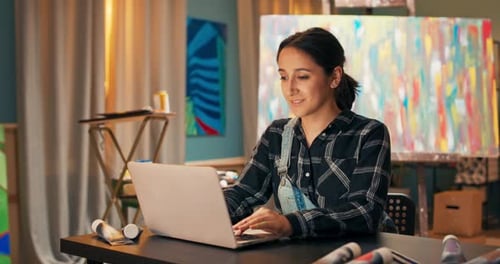 A Popular Artist Blogs on the Internet Sits in Paint Studio and Writes Back Comments