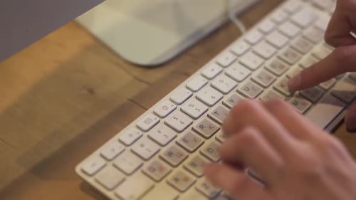 Blurred Defocused Hands Typing on Keyboard in Office Online Communication Close Up