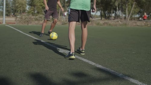 Football Team Players Making Kick-off in the Pitch