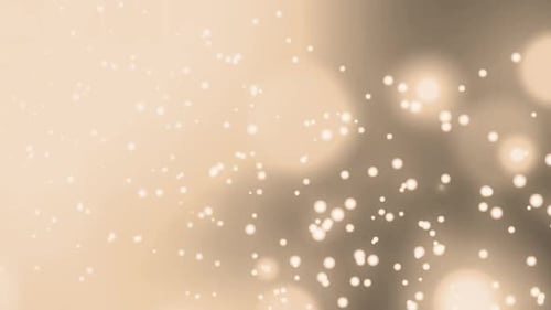 Animation de plusieurs points de lumière jaunes incandescents se déplaçant dans un mouvement hypnotique sur fond noir