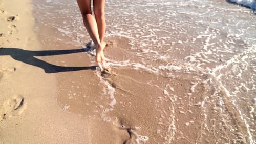 Young Woman Legs Walking on White Sand with Waves at Beach in Island, Cinematic