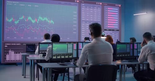 Male Trader Using Computer To Trade Stocks