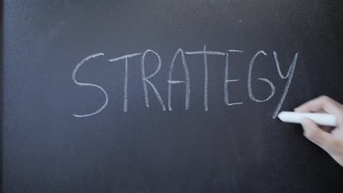 Hand Writing Strategy on Chalkboard