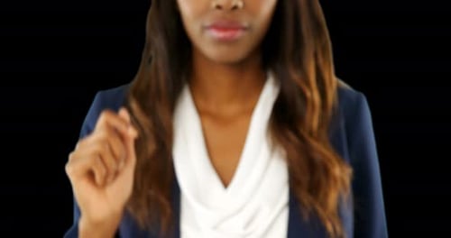 Businesswoman pressing a transparent screen