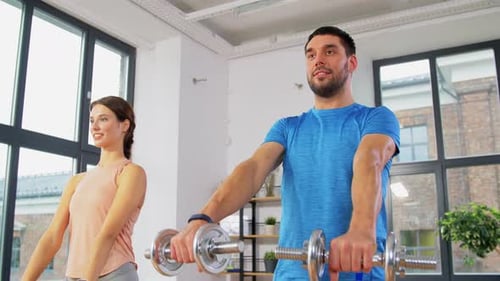 Happy Couple Exercising at Home