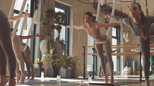 Aerial Yoga Group in Bright Studio Space