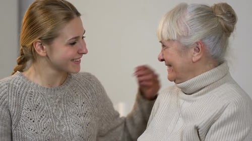 Loving Granddaughter Hugging Grandmother with Affection