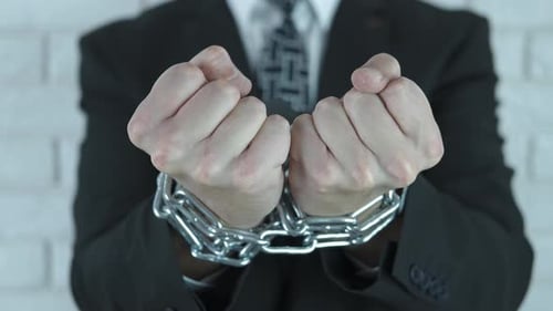 Man In Chains Trying To Escape