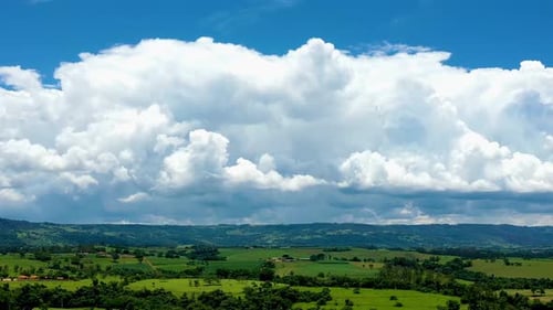 Aerial View of Green Landscape with Clouds
