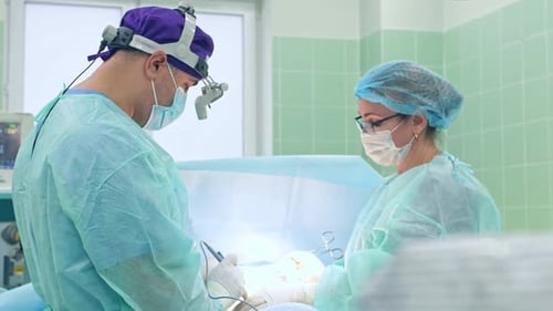 the Surgeon Performs a Surgical Operation