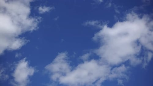 Blue Sky Drifting Clouds on Sunny Day