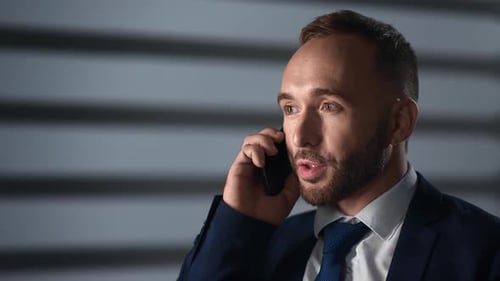 Closeup Smiling Male Boss Talking Smartphone Discussing Business Deal Night Office Jalousie Shadow