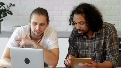 Young Adults Discussing Technology at Home