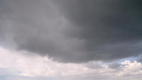 Dark Storm Clouds Transforming into Blue Sky