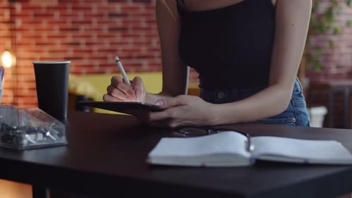 Female Fashion Designer Who Owns Digital Tablet Computer Technologies in Creative Production Studio