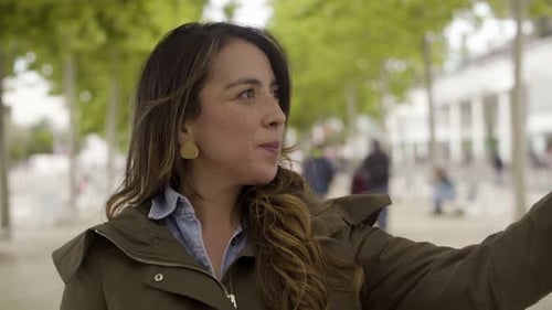 Woman Taking Selfie in Urban Park