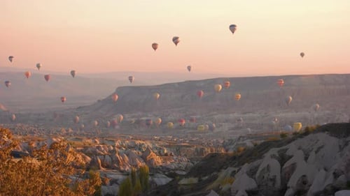 Hot Air Balloons Over Dreamy Landscape at Sunrise