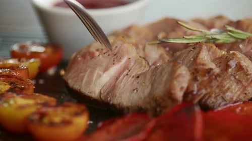 Close Up of Pork Tenderloin with Tomatoes