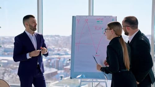 Small group of business people standing at office and solving problem at meeting.