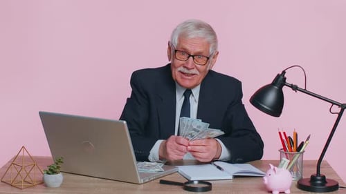 Senior Business Office Man Accountant or Banker Making Money Cash Calculations Income Earnings