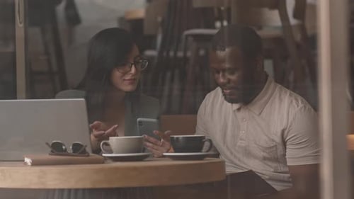 Diverse Colleagues Chatting in Cafe