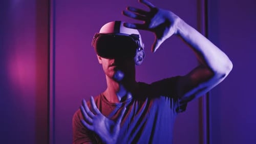 Man Using Virtual Reality Headset Indoors