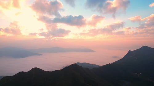Aerial view from drone, Epic sunbeam over clouds mountains.
