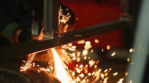 Angle Grinder Cutting Metal at Workshop