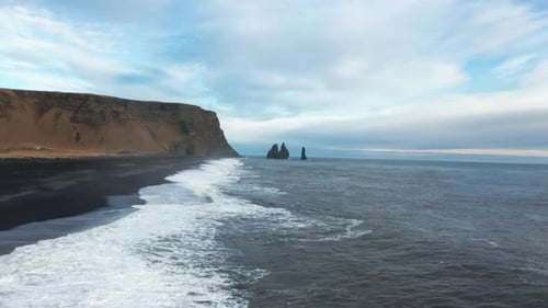 Drone Flight Over Black Sand Coastline