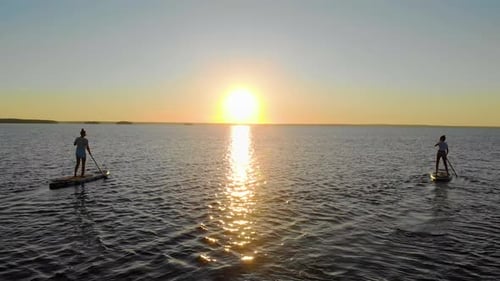 Women Walk on the Water on Sup Boards