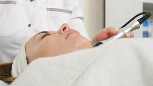 Woman Receiving Facial Treatment at Medical Spa