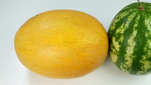Melon and Watermelon on a White Surface