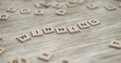 3D Scrabble Tiles Forming Winning Word