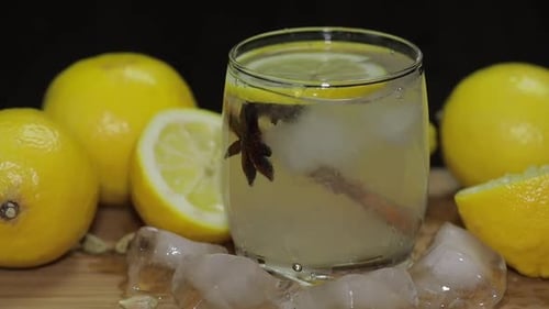 Refreshing Citrus Drink with Lemons and Ice