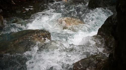 Clear River Water Rushing Over Rocks
