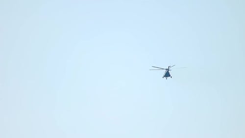 Helicopter Flying Against a Clear Sky