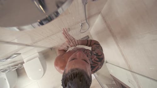 Tattooed Man Taking a Shower, Bird's Eye View