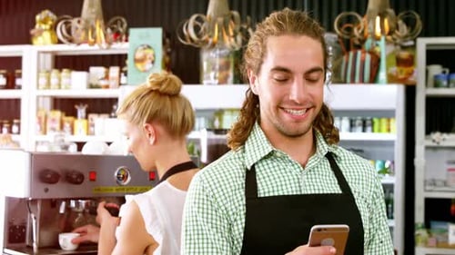 Cafe Employees Working with Espresso Machine and Phone