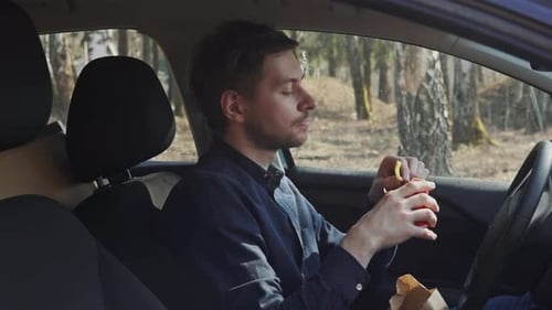 The Guy in the Car Eats Fasfood