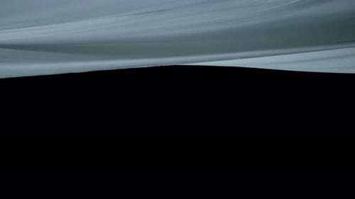 Light Silken Fabric Billows on Black Backdrop