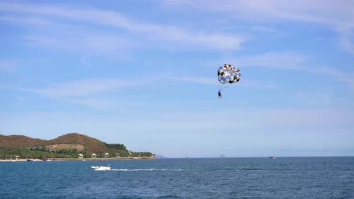 Parasailing Over the Sea. Summer Vacation Concept
