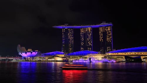 4k Time-lapse of Singapore city at night with beautiful light show in marina bay water front