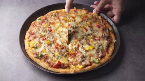 Slicing Freshly Baked Pizza Overhead Flat Lay