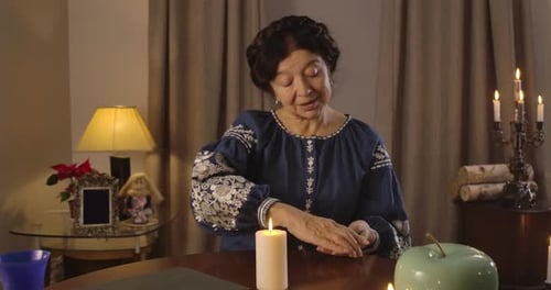Brunette Caucasian Woman with Brown Eyes Putting Cards on the Table Face Down. Nice Mature Fortune