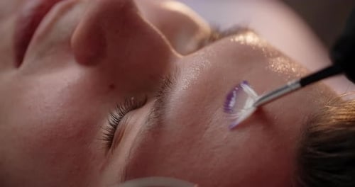 Beautician Applies Oil Mask to the Man's Face at the Beauty Salon Prores HQ