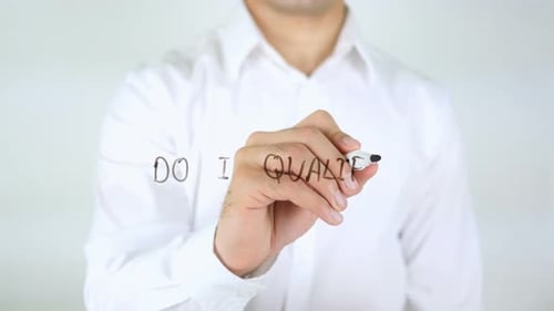 Man Writes Do I Qualify on Clear Surface